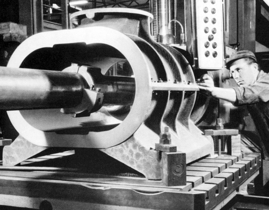 Old positive displacement blower An old picture of an employee with positive displacement blower